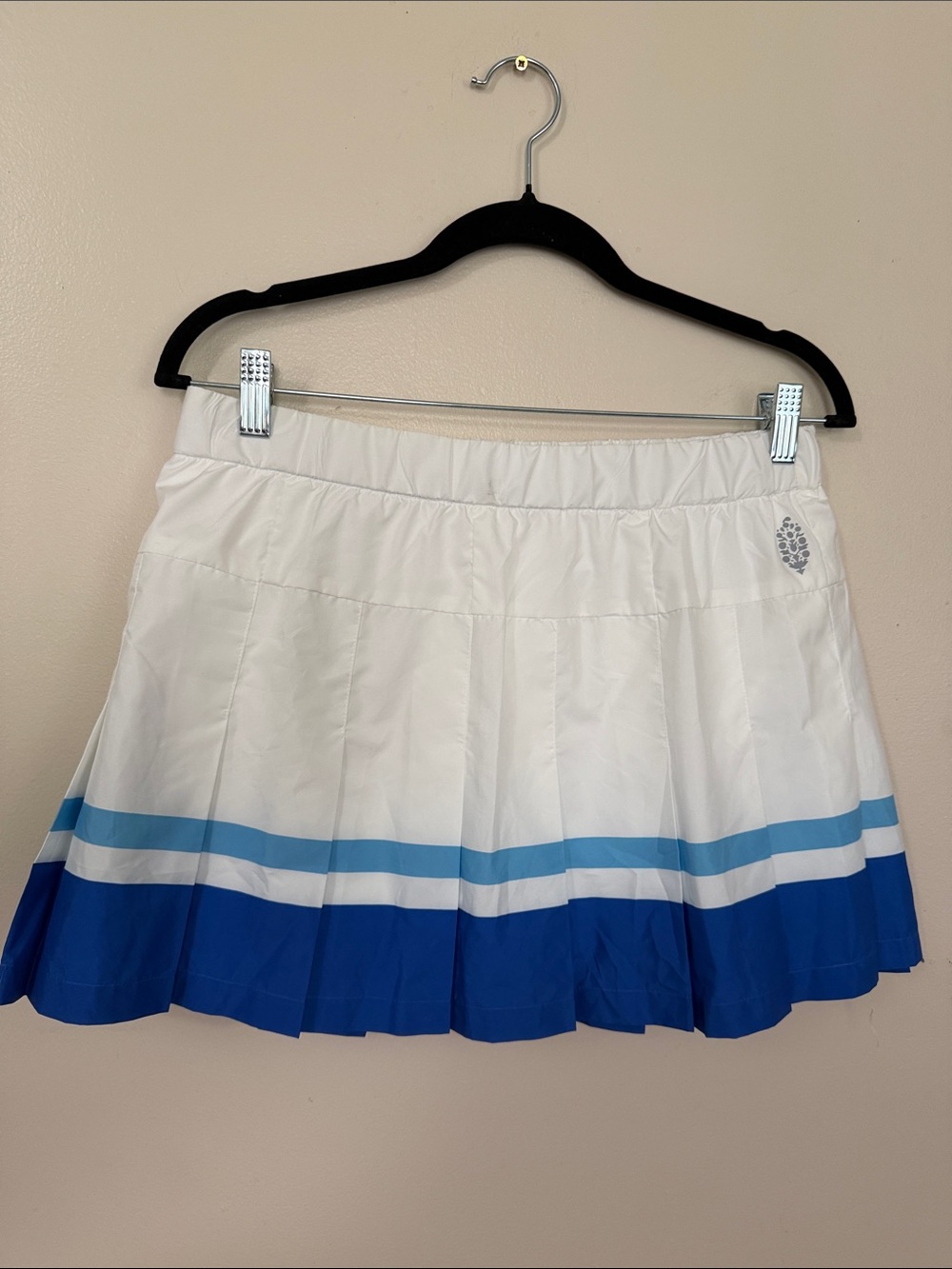 FP Movement by Free People White and Blue Striped Pleated Skirt- has shorts.